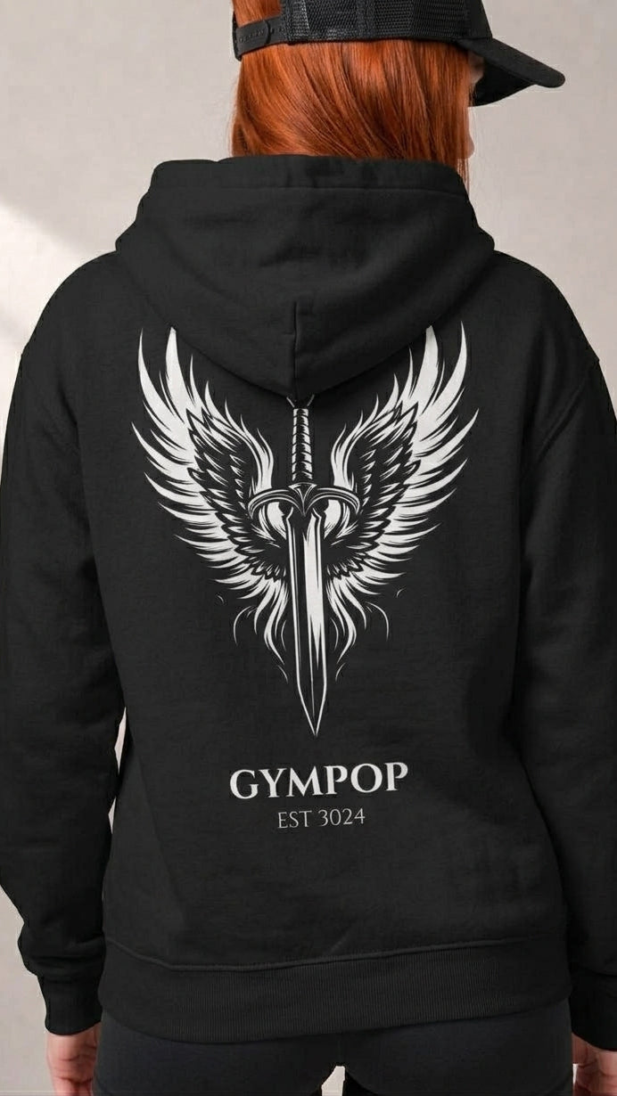 A person shown from the back wearing a black hoodie with a large white winged dagger graphic and the text 'GYMPOP EST 3024' printed on the back. The person has red hair and is wearing a black cap, set against a neutral gray background.