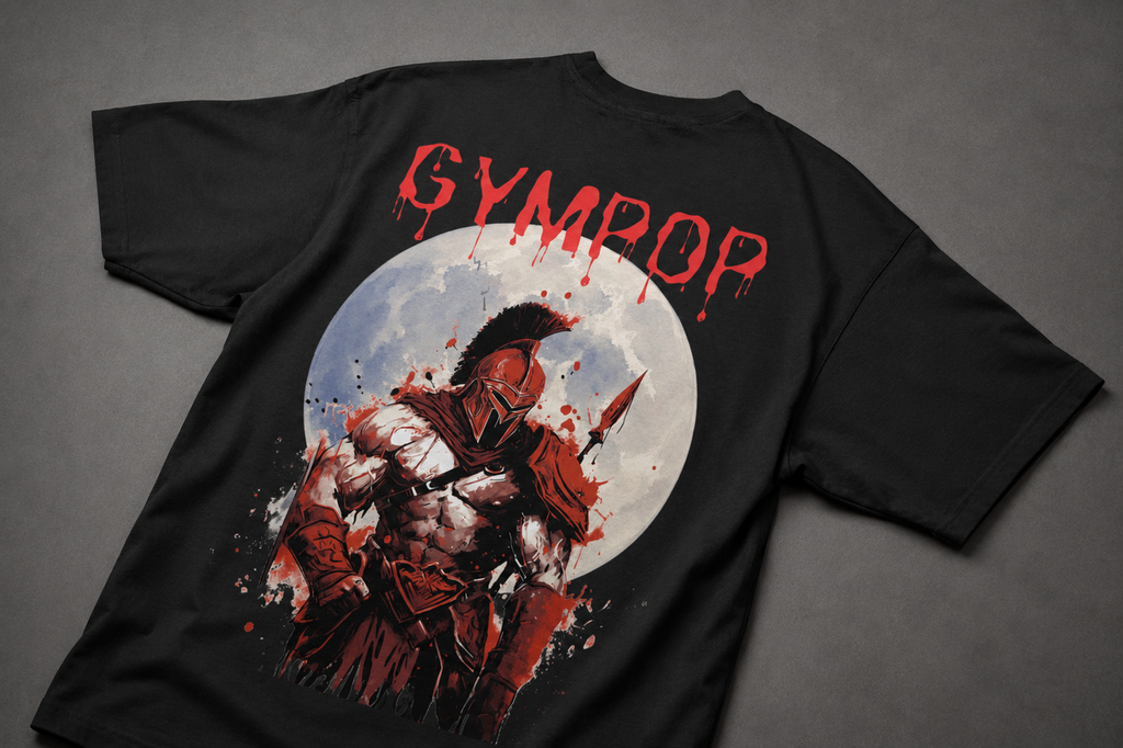 A black short-sleeve t-shirt laid flat on a dark gray background, featuring a large graphic print on the back. The graphic displays a Spartan warrior holding a spear in front of a white full moon, with the word 'GYMPOP' printed in a dripping red font above the artwork.