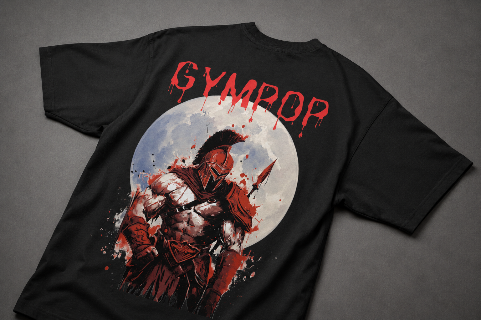A black short-sleeve t-shirt laid flat on a dark gray background, featuring a large graphic print on the back. The graphic displays a Spartan warrior holding a spear in front of a white full moon, with the word 'GYMPOP' printed in a dripping red font above the artwork.