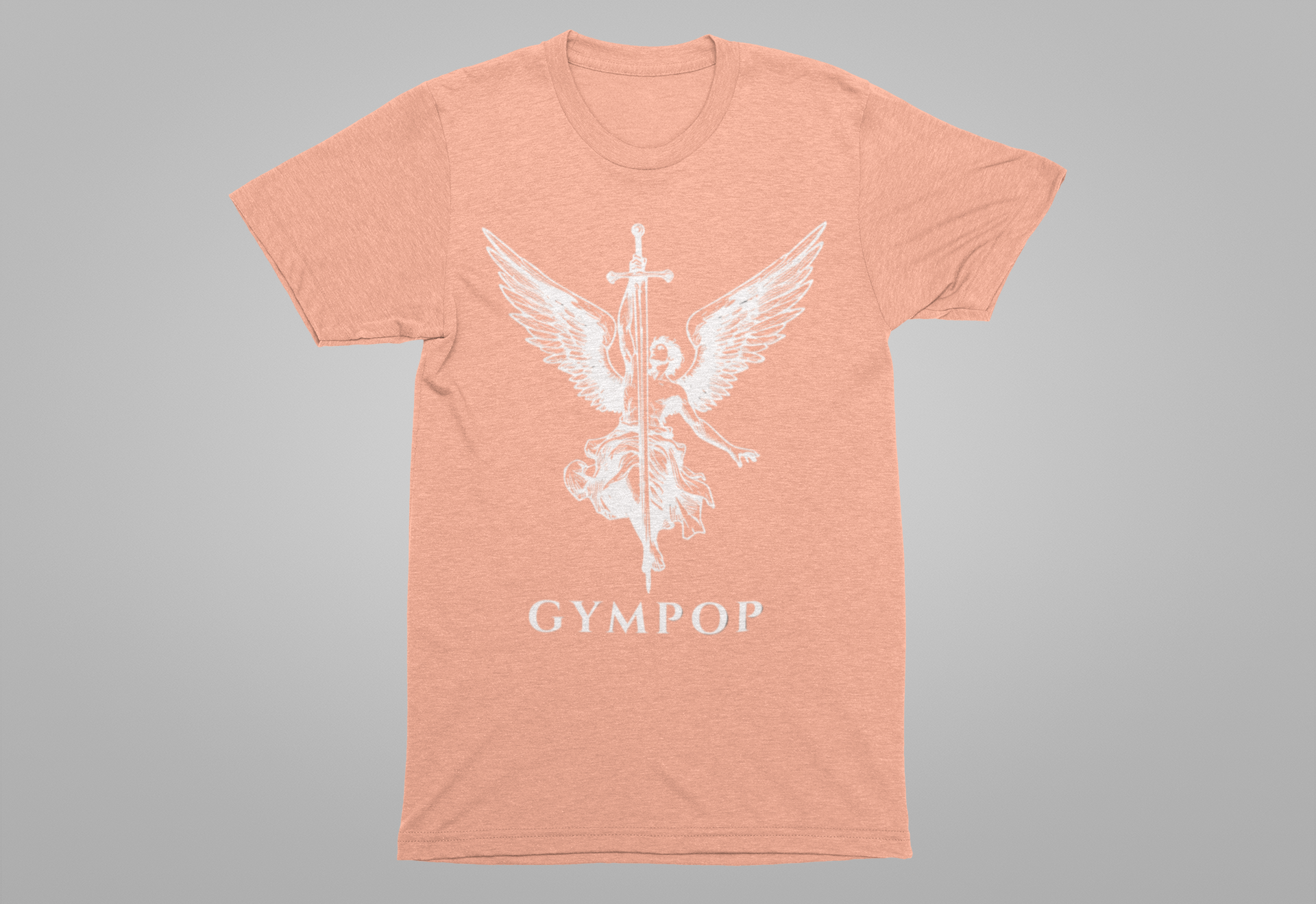 A heather peach short-sleeve t-shirt with a white graphic of an angel holding a sword and the text 'GYMPOP' printed below, displayed on a neutral gray background.