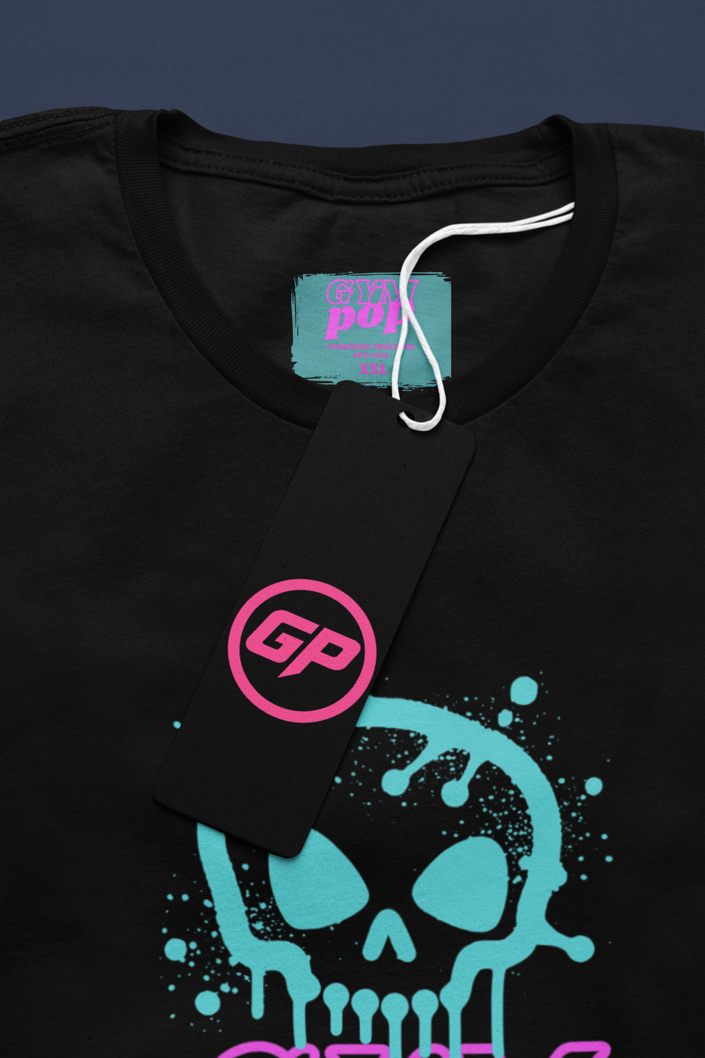 Gympop graffiti skull signature tee mockup featuring a round-neck T-shirt with a paper tag and graffiti skull design.