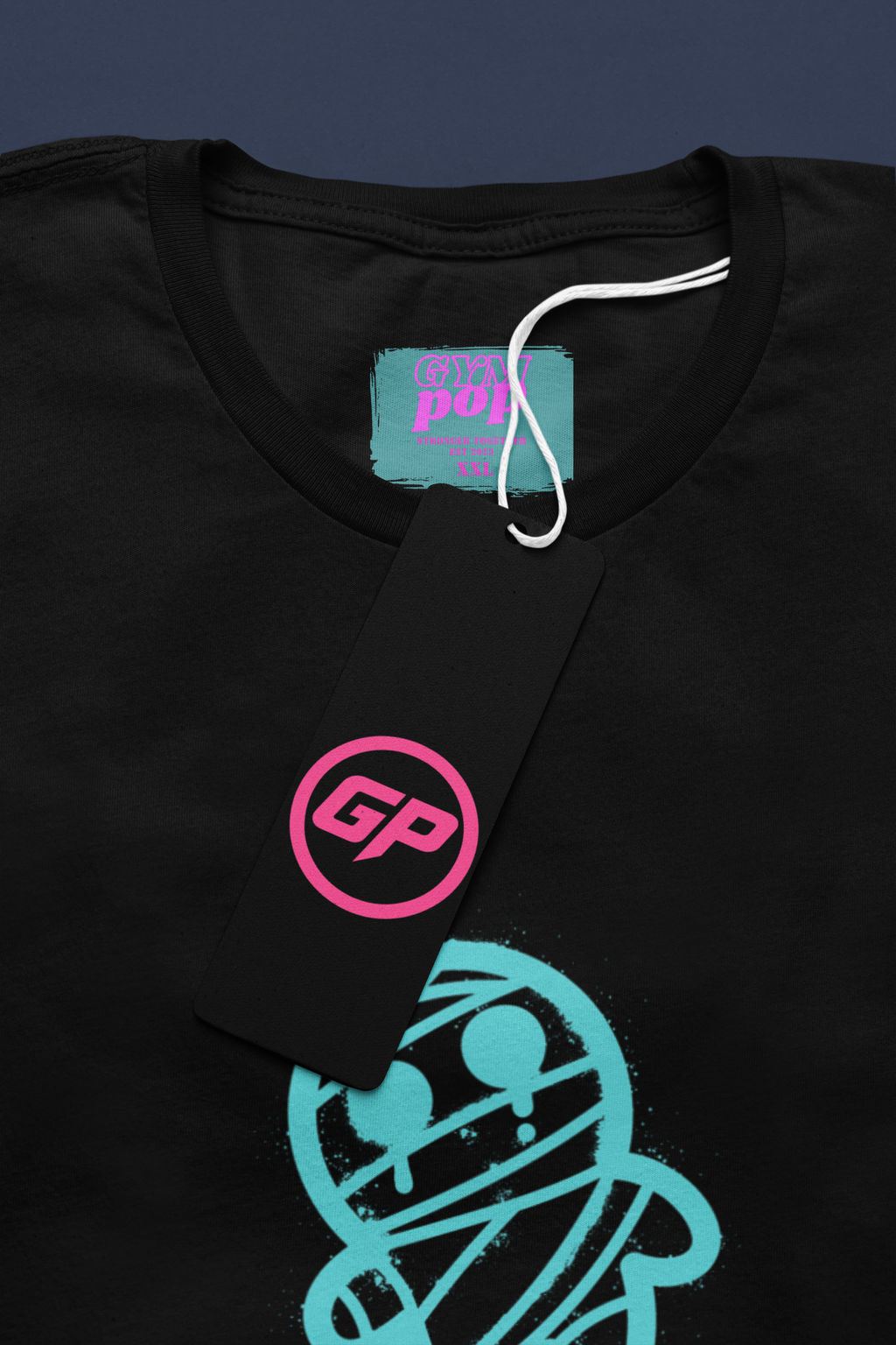 Gympop Graffiti Mummy Signature Tee mockup featuring a round-neck t-shirt with a paper tag display.