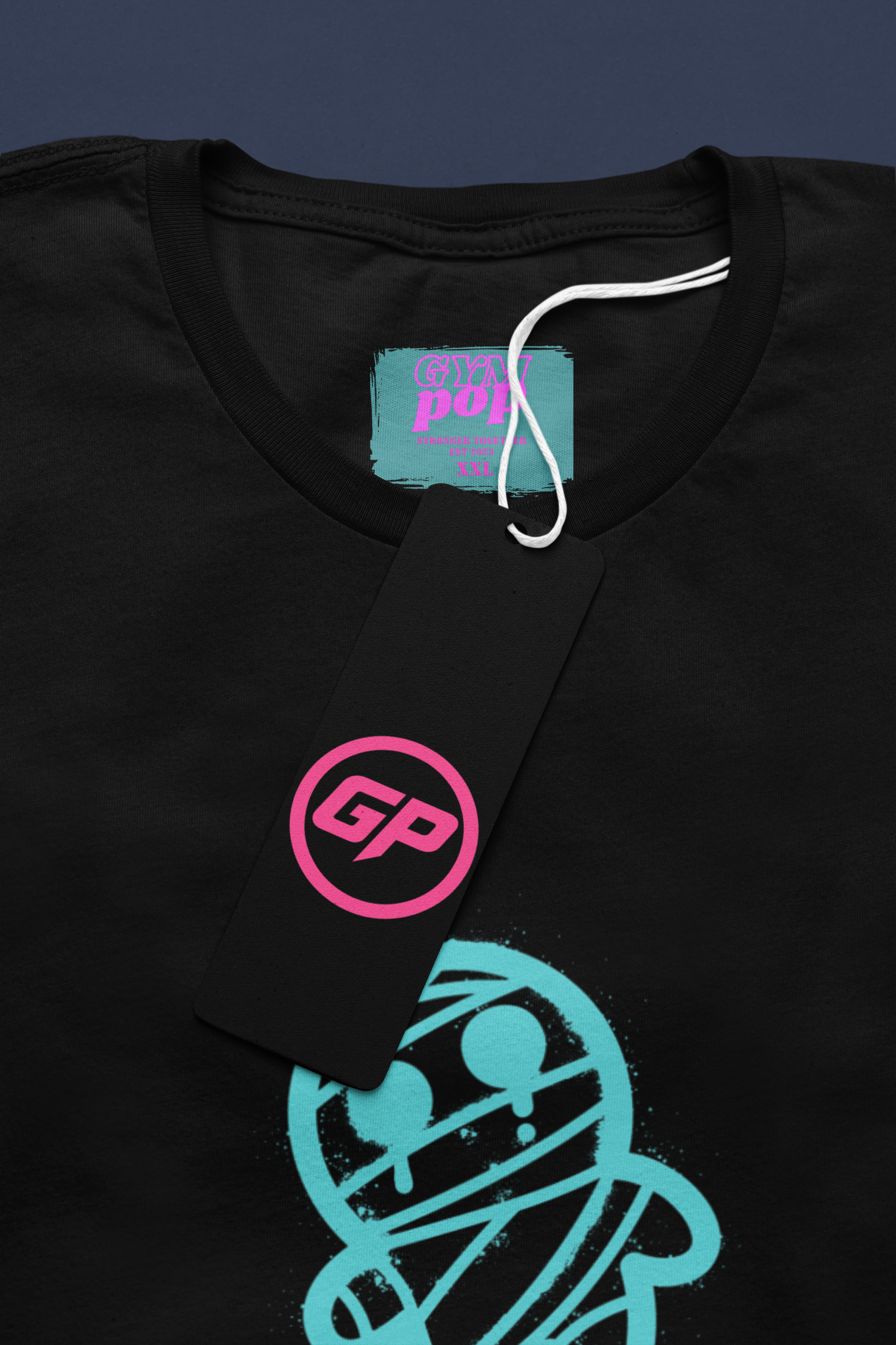 Gympop Graffiti Mummy Signature Tee mockup featuring a round-neck t-shirt with a paper tag display.