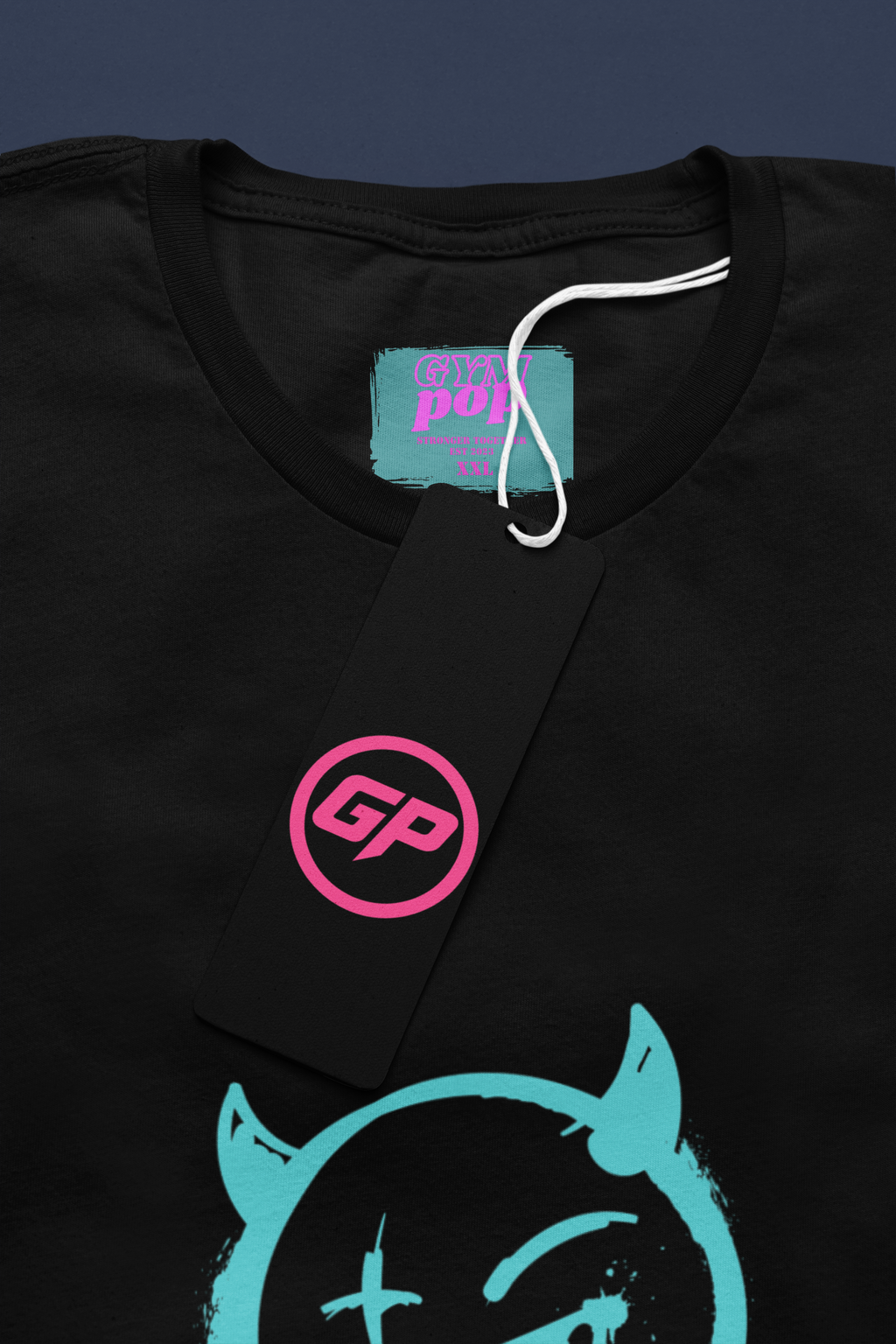 Gympop Neon Devil Signature Tee mockup featuring a round-neck T-shirt with a paper tag and vibrant neon devil design.
