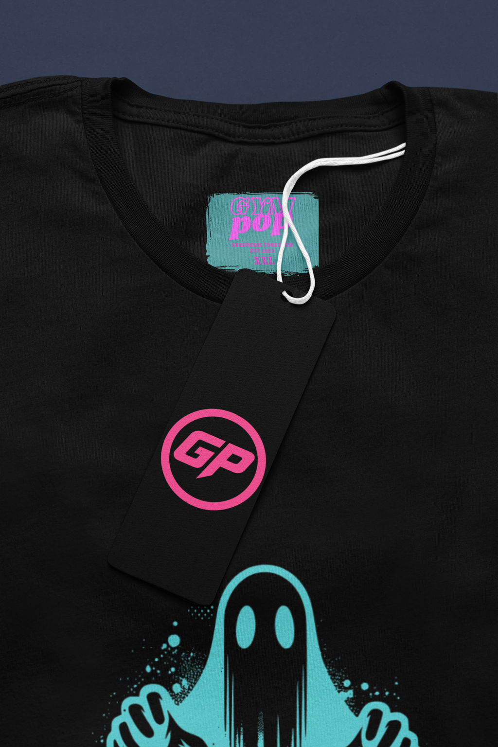 Gympop Graffiti Ghost Signature Tee mockup showing a round-neck T-shirt with graffiti-style ghost design and paper tag.