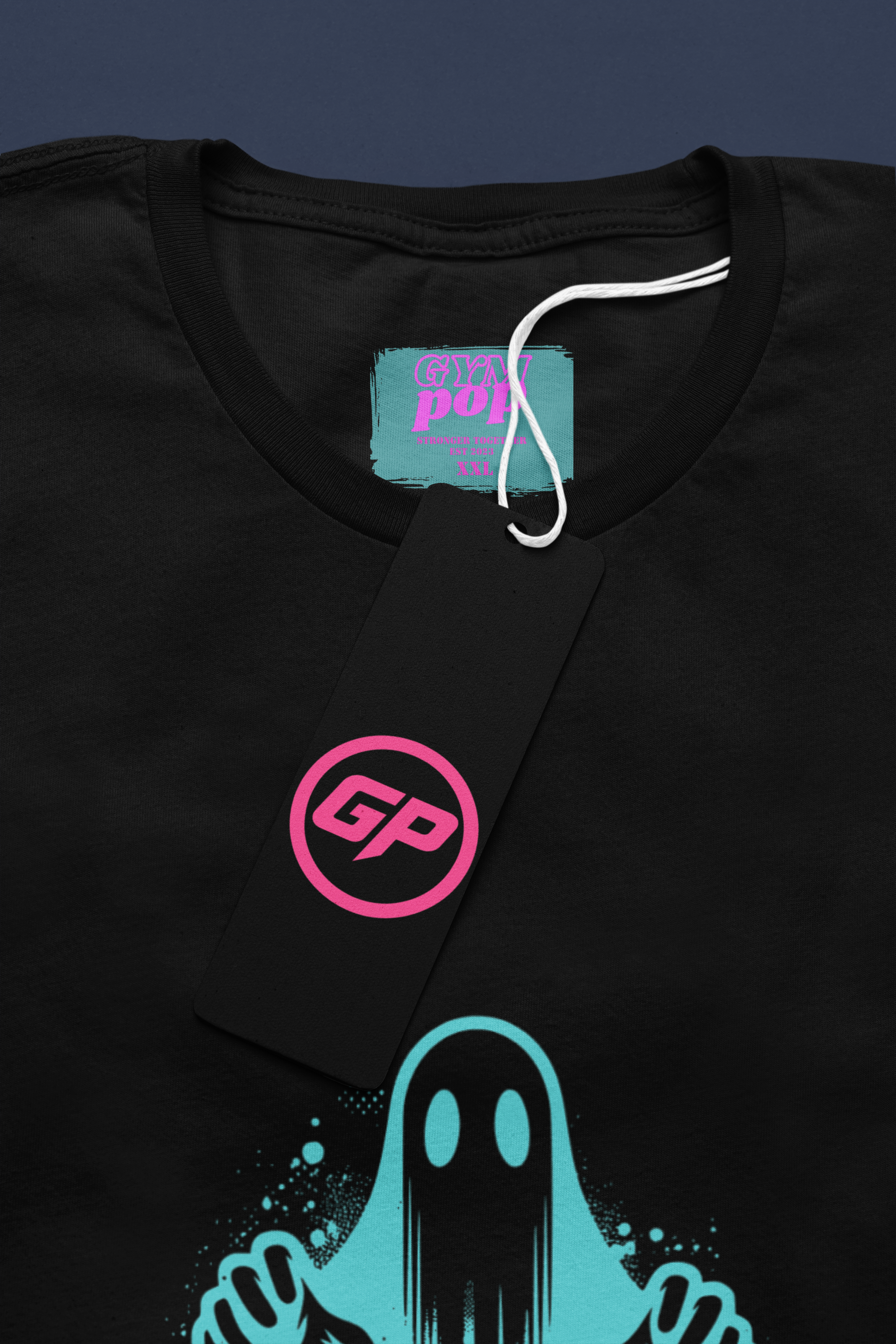Gympop Graffiti Ghost Signature Tee mockup showing a round-neck T-shirt with graffiti-style ghost design and paper tag.